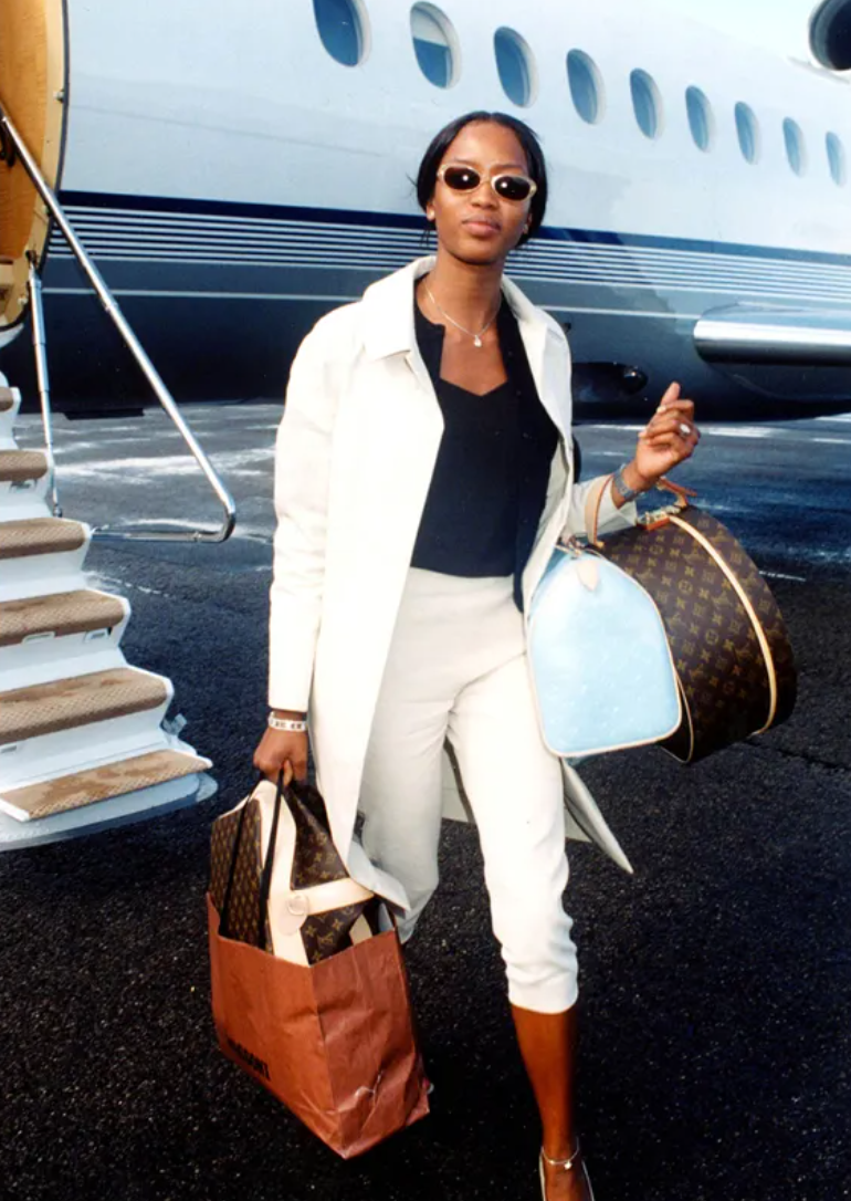 Naomi Cambell Getting off a Private Jet with a Designer Handbag