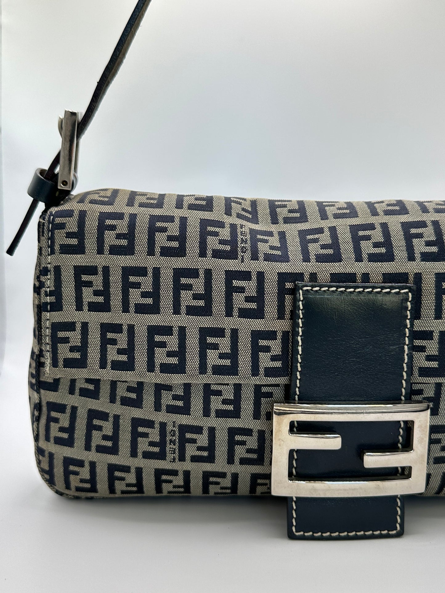 Vintage fendi baguette in navy colour with silver hardware up close photo