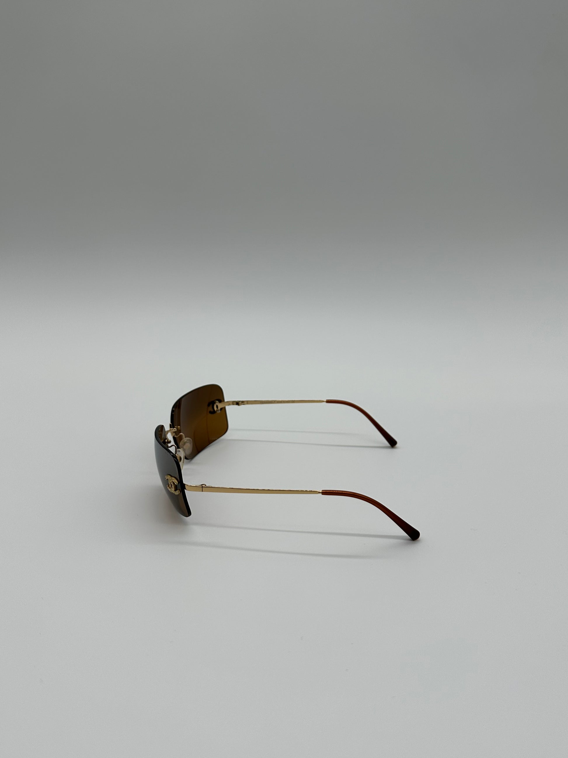 Vintage Brown Rimless Chanel Sunglasses by nothing new